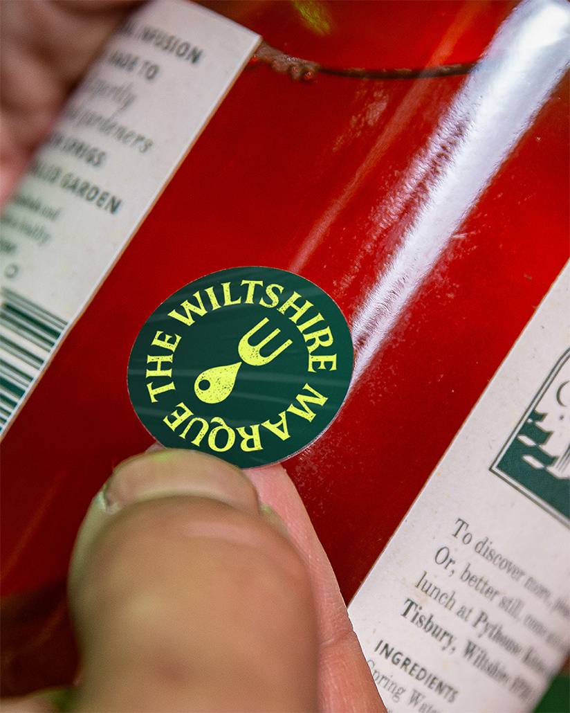 A Wiltshire Marque sticker on a bottle. Designed by Mighty, brand agency
