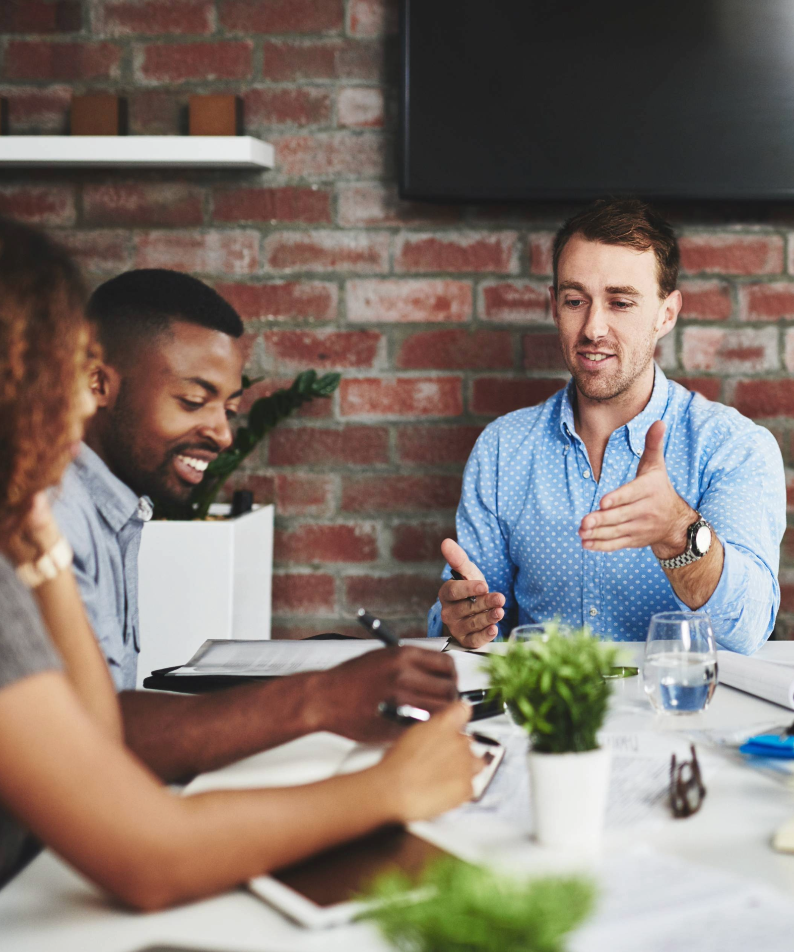 A team discussing brand strategy in a modern office